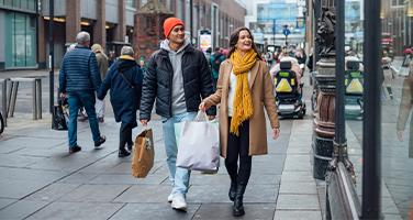 Two People With Shopping Bags